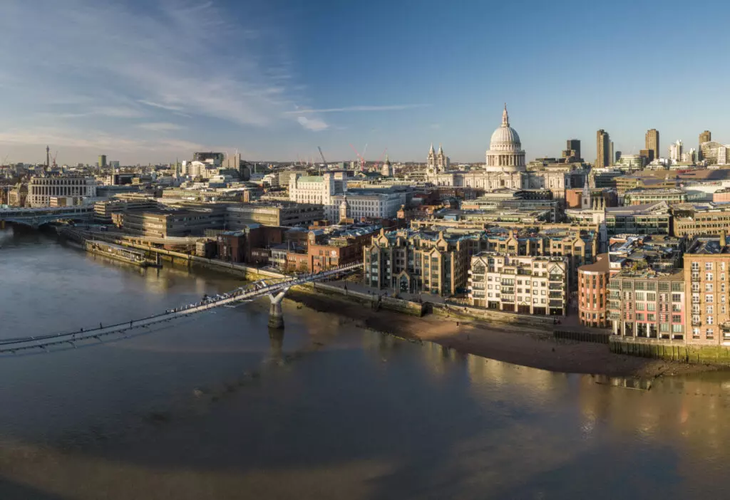 Architecture, Building, City, Cityscape, Metropolis, Urban, Water, Waterfront, Spire, Tower, Neighborhood, Bridge, Outdoors, Nature, Scenery, Office Building, Construction, Construction Crane, Aerial View, Dome